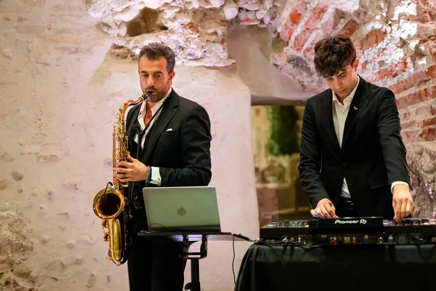 Live sax and DJ set side by side — the team at work on an event