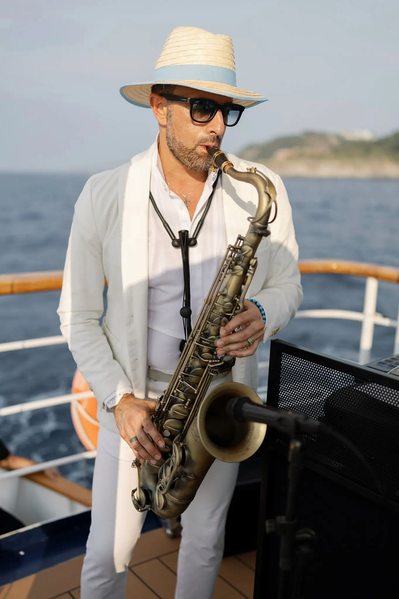 DJ Guinness · live sax · party on a boat along the coast